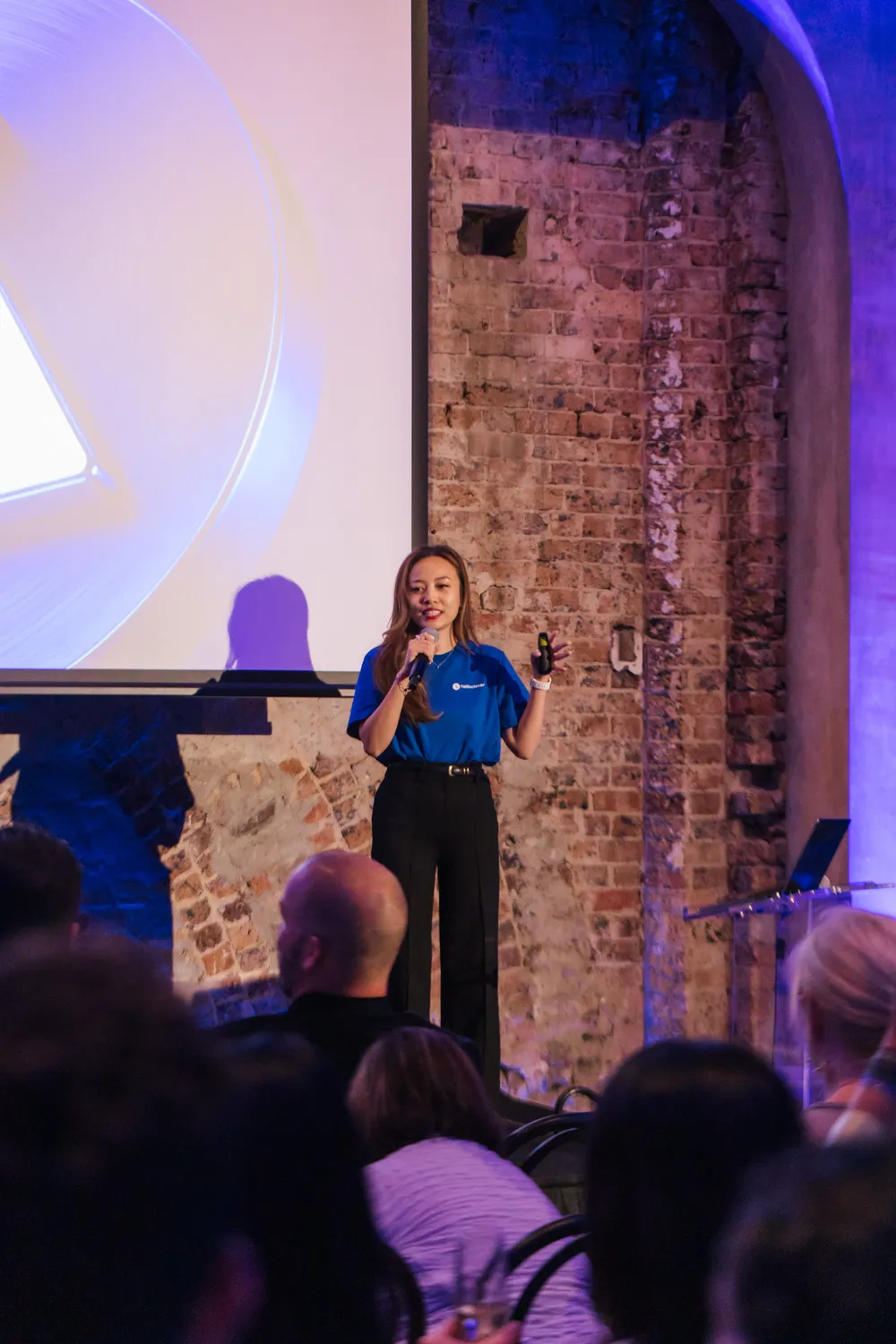 A Hello Clever speaker presenting on stage at Elevate
